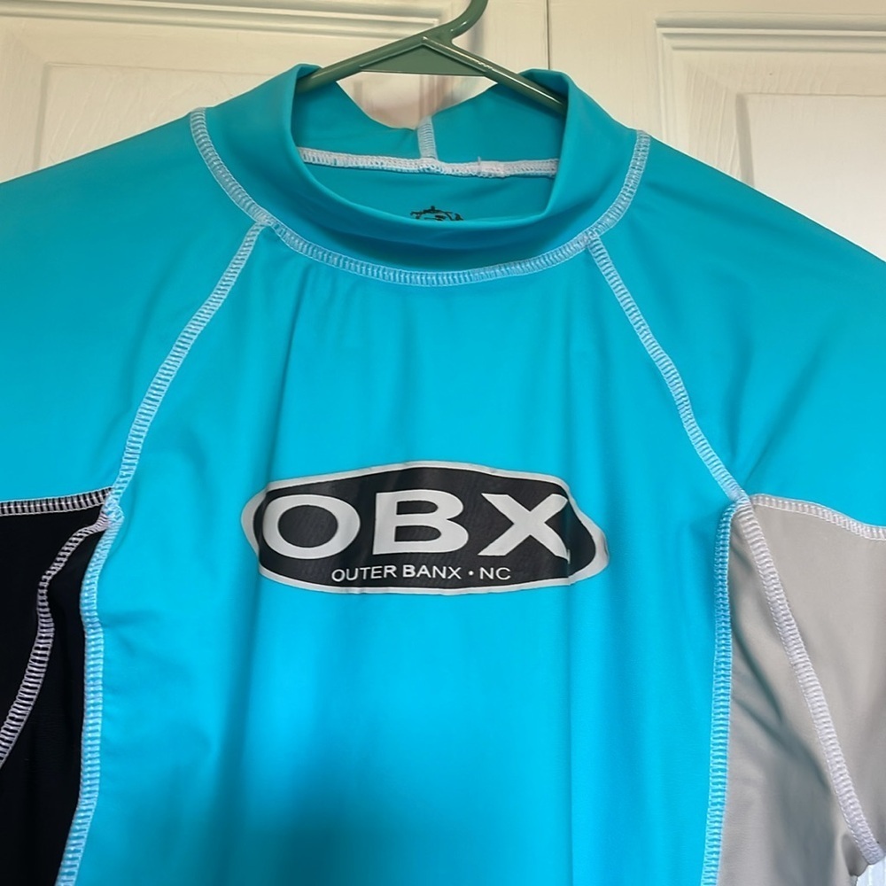 Women’s Sunspecs Sal rash guard Outer Banx logo color block mock neck aqua/black
